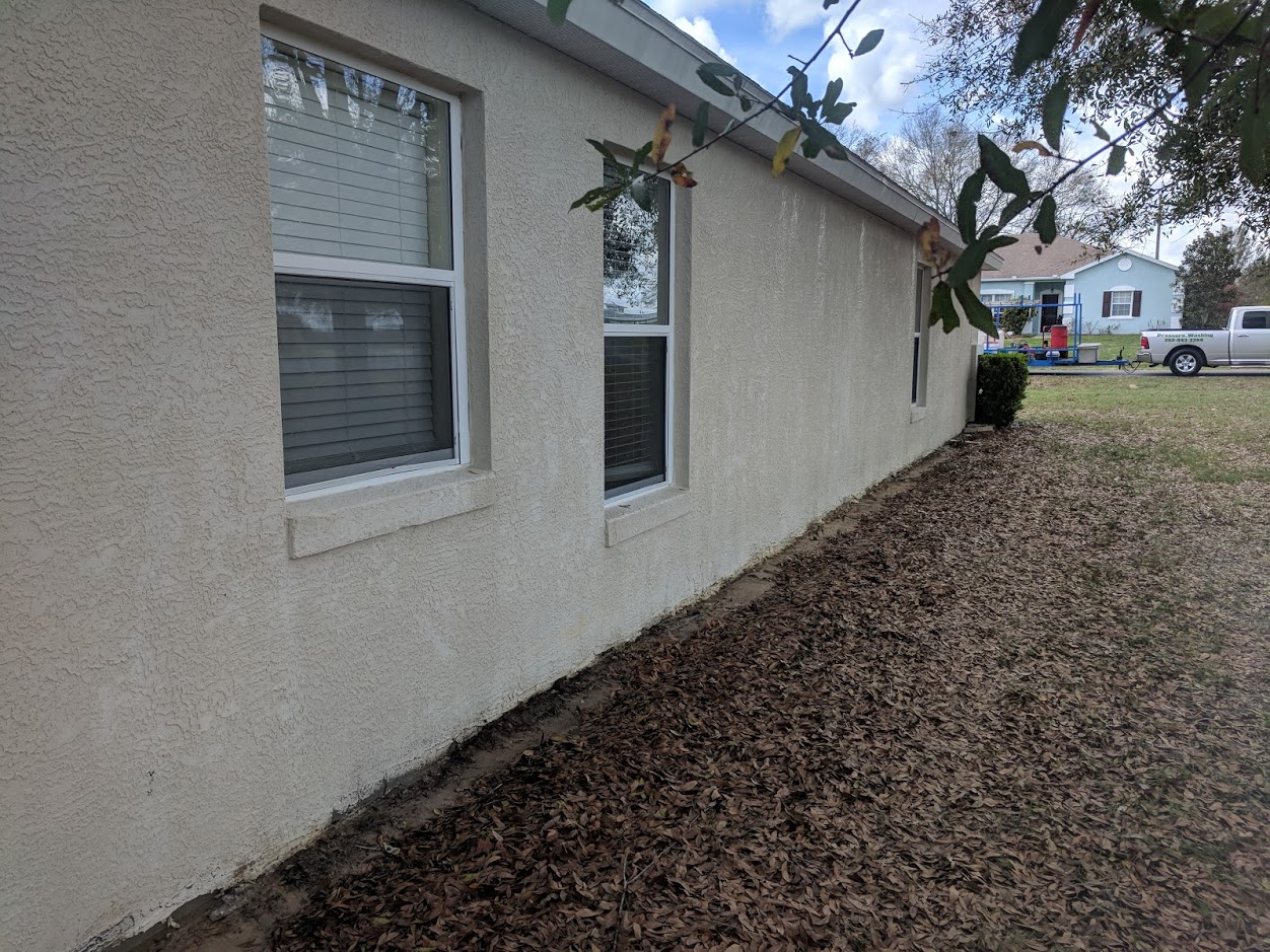 Home exterior after soft wash house washing by License to Wash